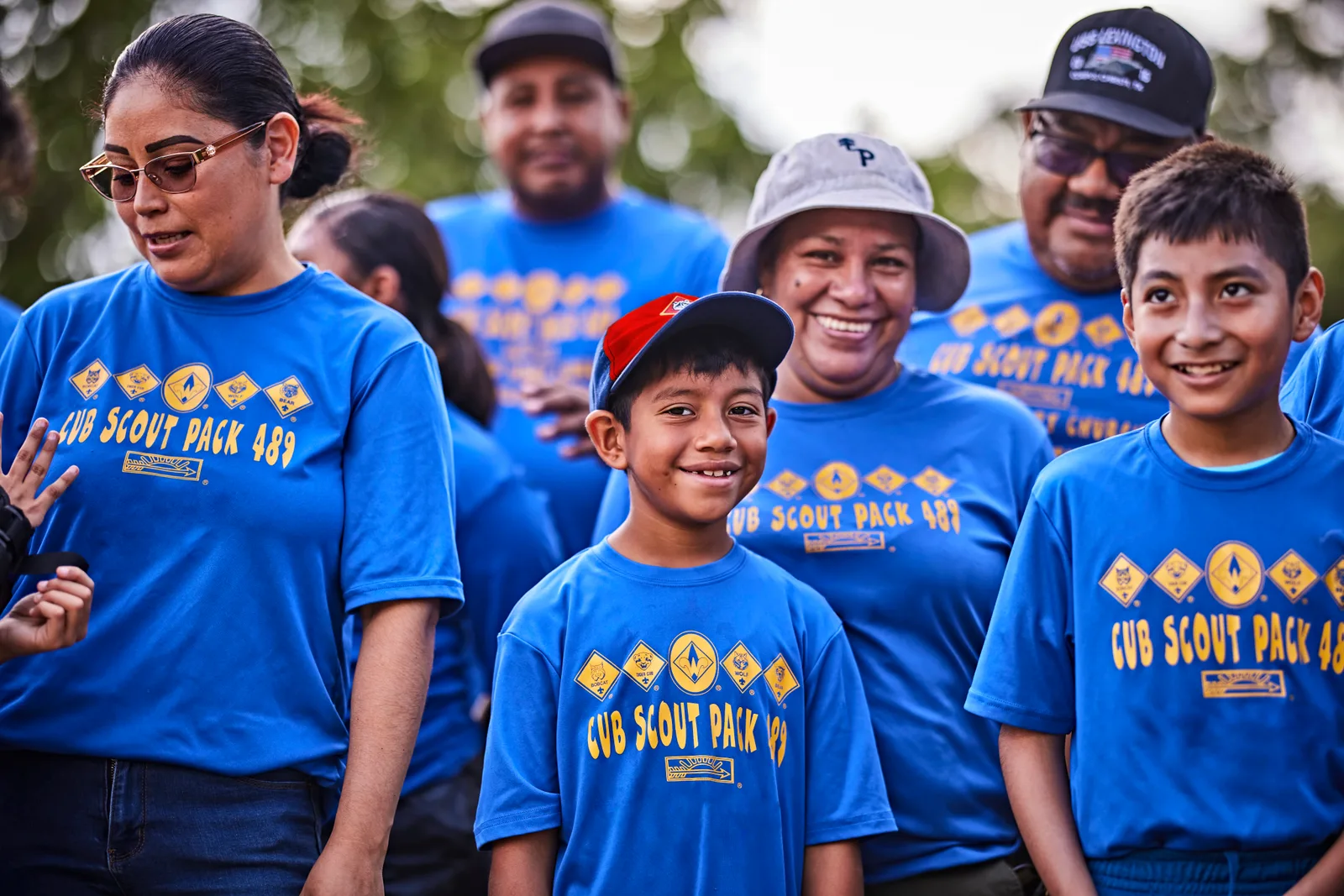 Cub Scouts and their parents together in pack shirts