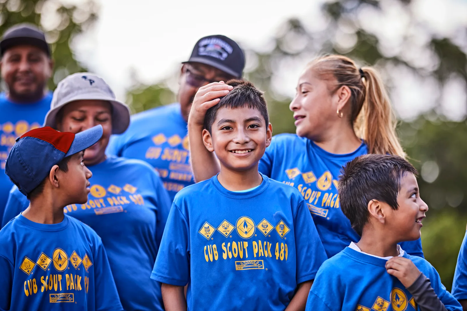Cub Scouts and their parents together in matching pack shirts
